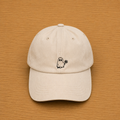 Gorra color beige con fantasma bordado a mano