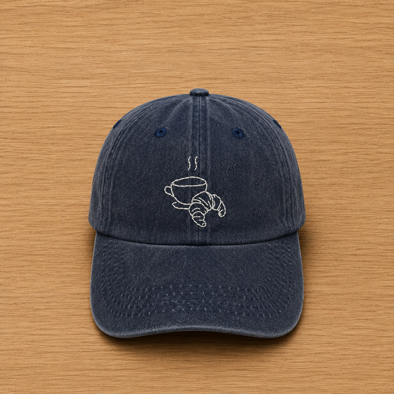 Dark blue cap with hand-embroidered coffee and croissant