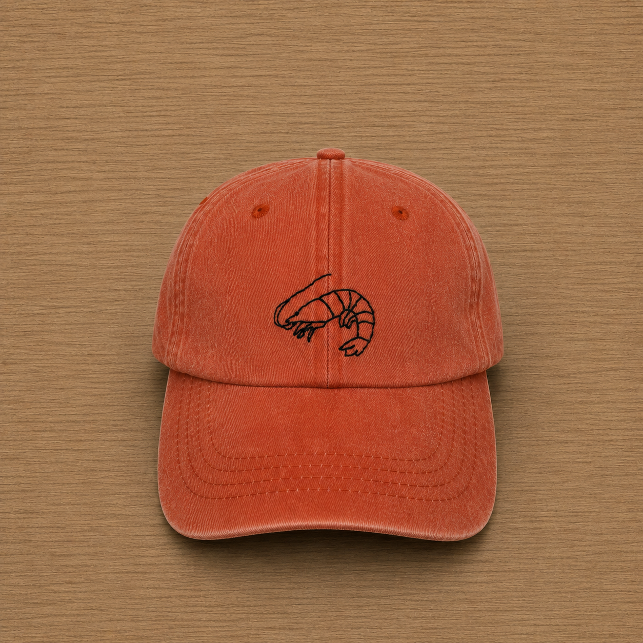 Gorra color naranja con langostino bordado a mano