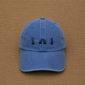 Blue cap with hand-embroidered worm